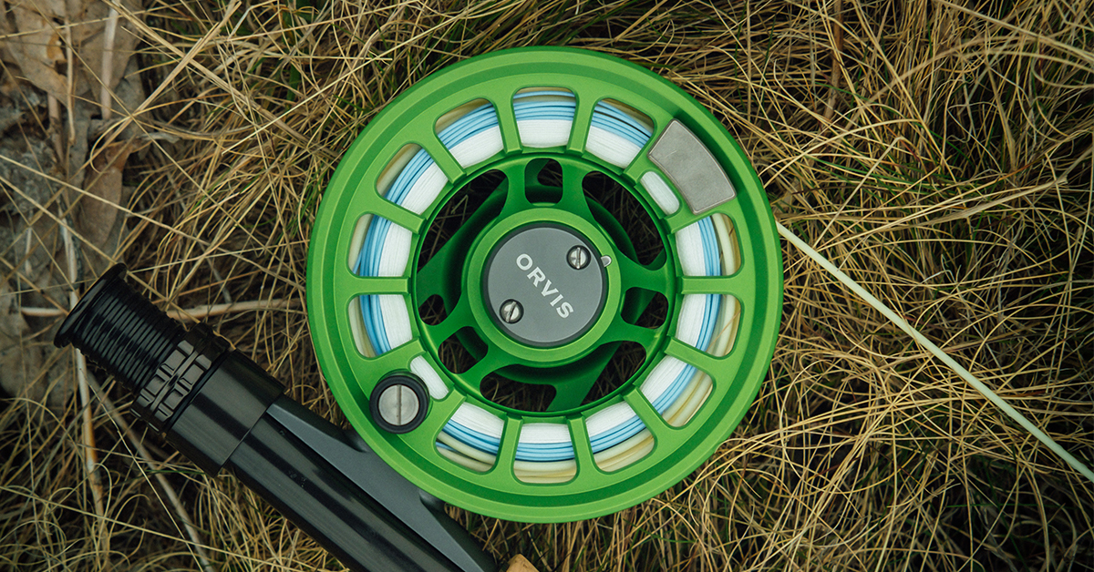 Fly reel laying on grass