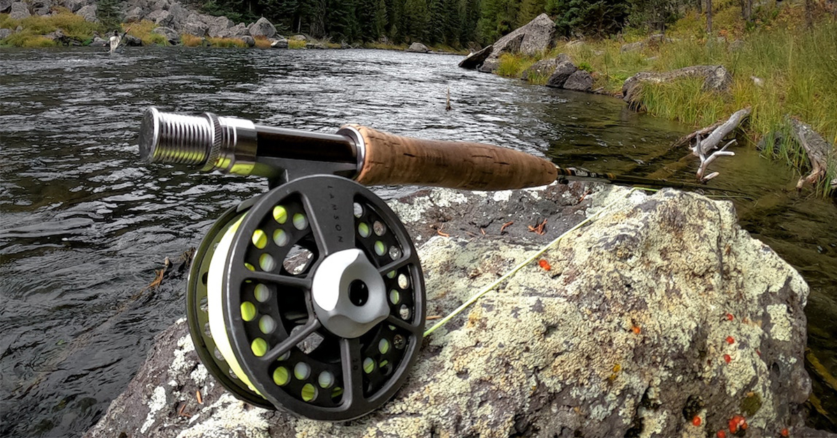 Fly rod on a rock in a river